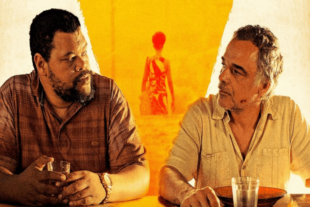 Dois homens sentados um ao lado do outro, ambos usando camisas de botão se encarando, ao fundo uma imagem amarela de uma mulher de costas indo embora