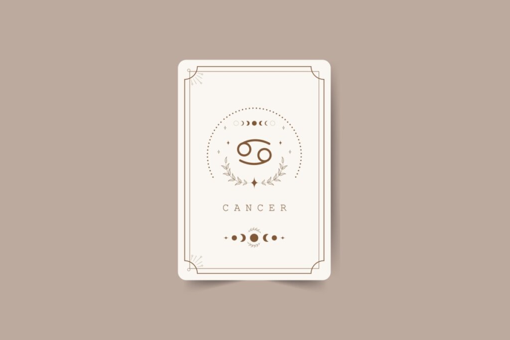 ilustração de uma carta branca com símbolo do signo de câncer marrom com pontos em volta, nome do signo em inglês embaixo e desenhos de lua. carta está em fundo marrom-claro
