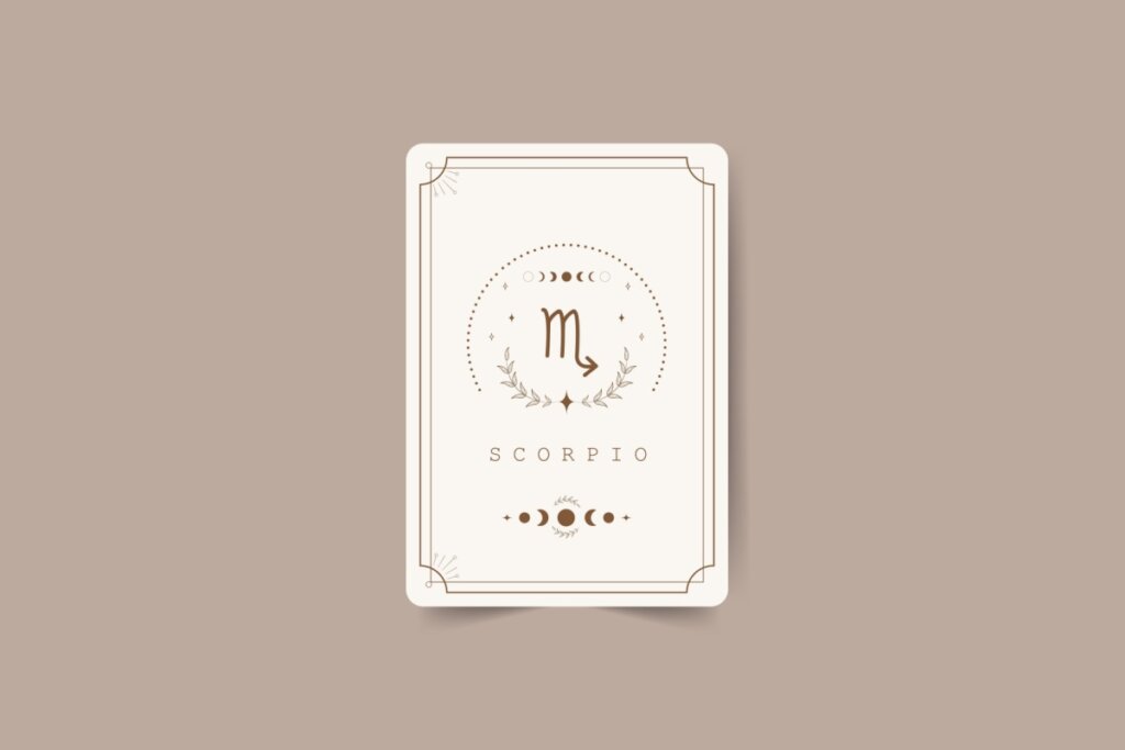 ilustração de uma carta branca com símbolo do signo de escorpião marrom com pontos em volta, nome do signo em inglês embaixo e desenhos de lua. carta está em fundo marrom-claro