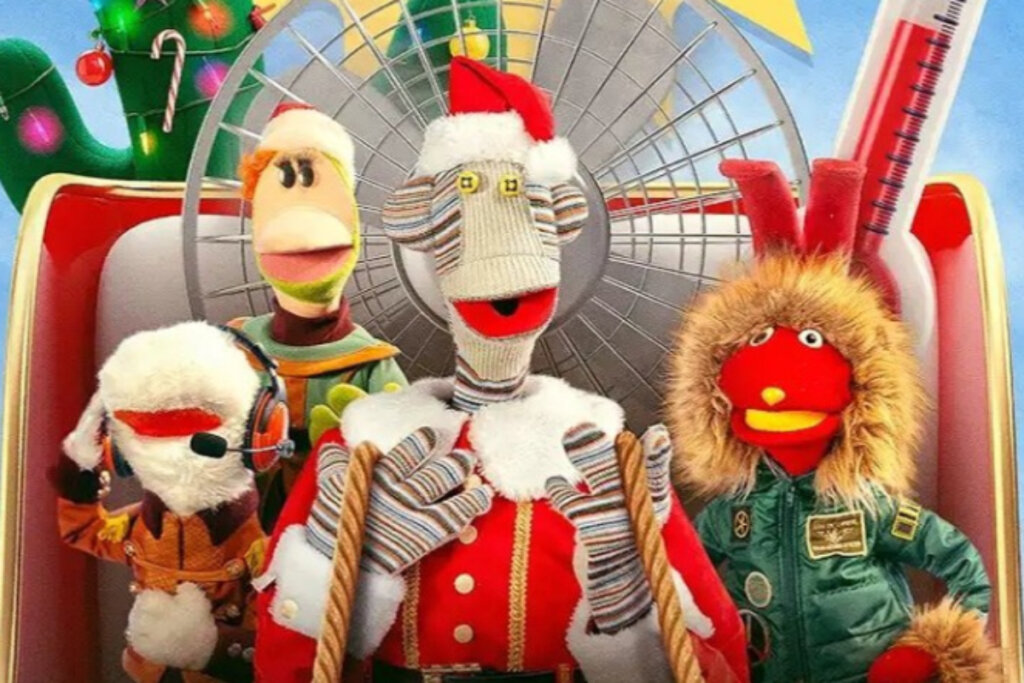 imagem de quatro personagens de tecido com roupa de natal sentados em trenó