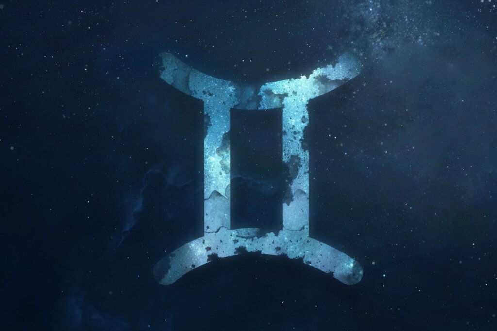 símbolo do signo de gêmeos em um fundo azul sobre fundo azul-escuro estrelado