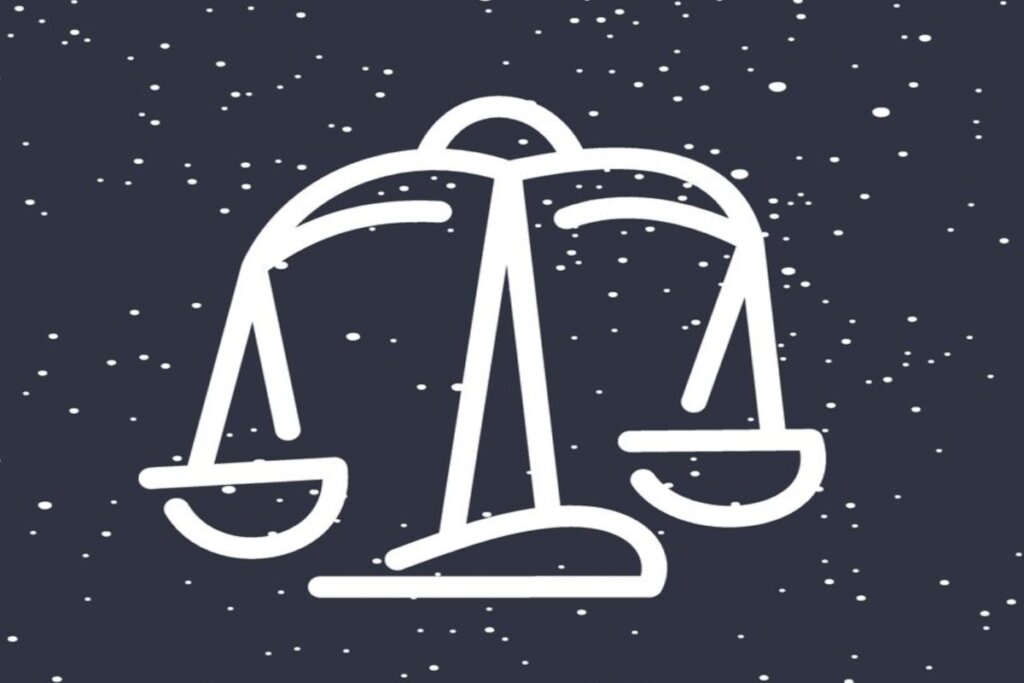 Ilustração branca de uma balança representando o signo de libra sobre fundo azul-escuro com estrelas