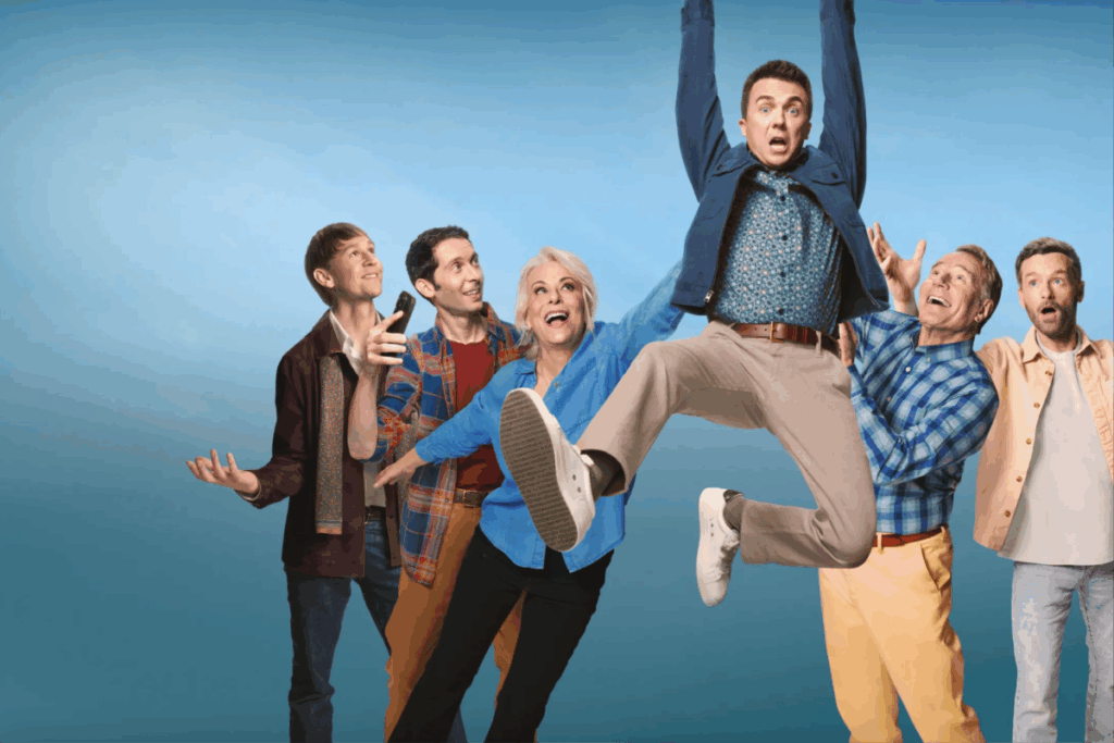 Grupo de pessoas reagindo animadamente enquanto um homem salta no ar com expressão surpresa contra fundo azul