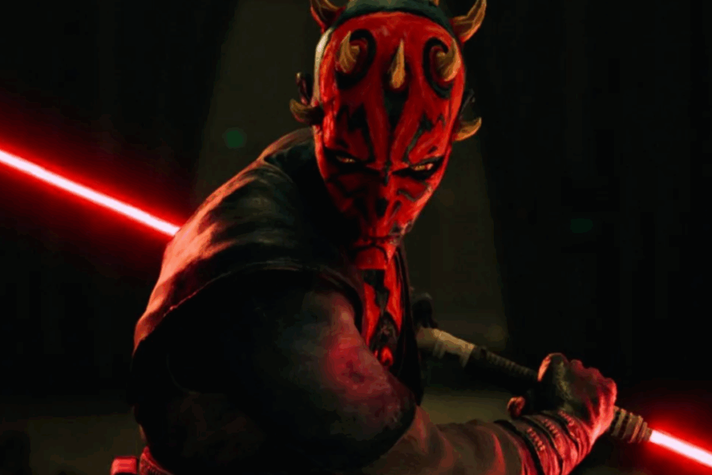 Personagem com rosto vermelho e preto empunhando um sabre de luz vermelho em posição de ataque em ambiente escuro