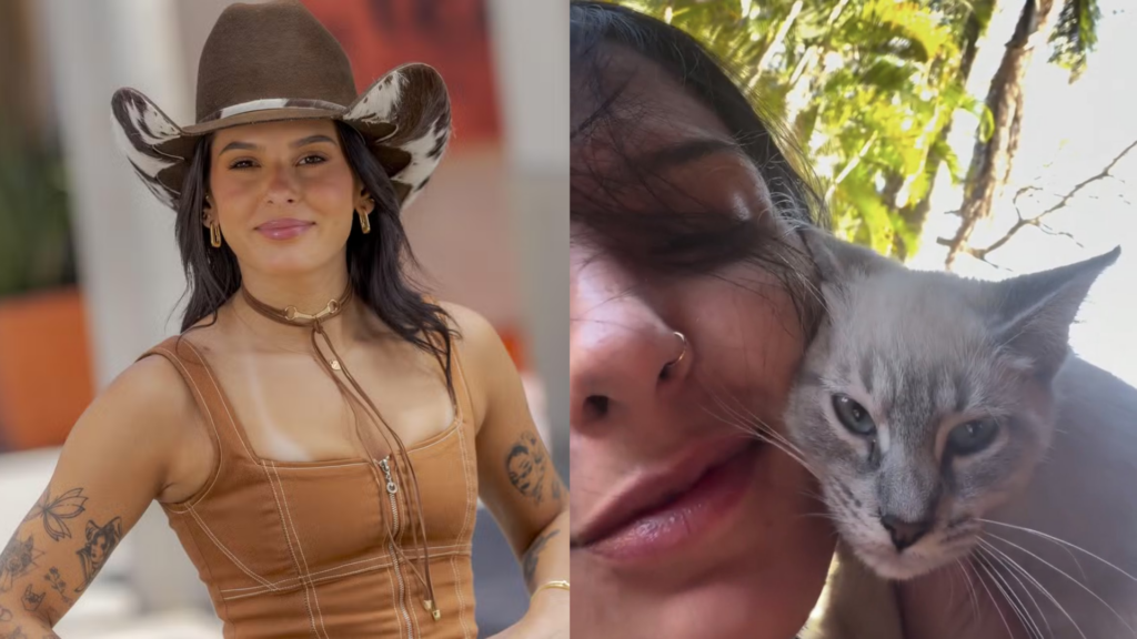 Ana Castela com o rosto encostado em um gato