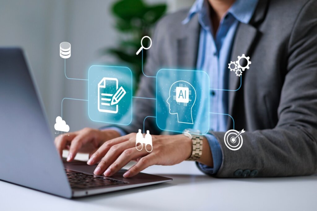 Imagem de pessoa mexendo no computador ao fundo com ilustração de funcionamento de inteligência artifical a frente