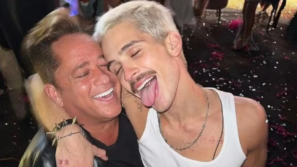 Leonardo e João Guilherme abraçados sorrindo