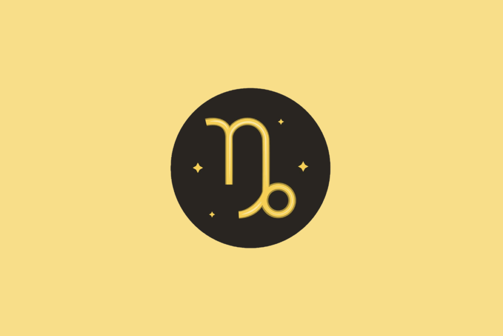 Símbolo do signo de Capricórnio em um círculo preto sobre fundo amarelo.