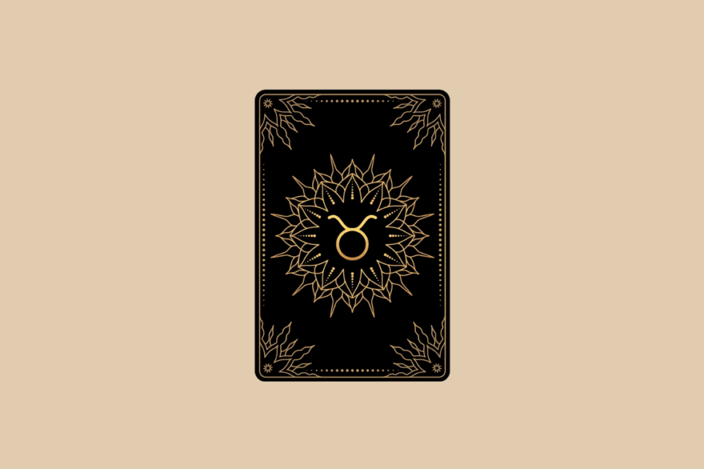 Ilustração de uma carta de tarô preta em fundo bege, com detalhes dourados em mandala e o símbolo do signo de Touro no centro.