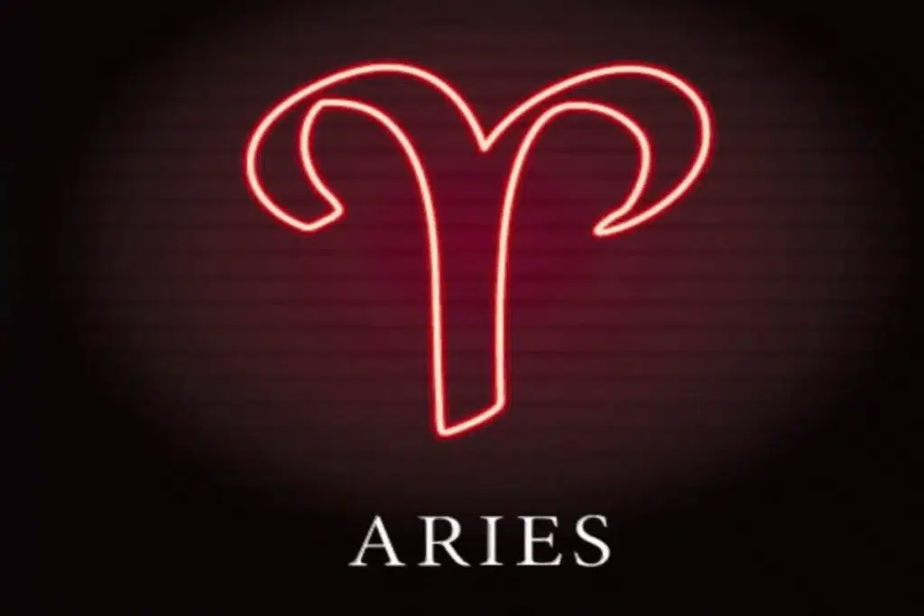 Ilustração do símbolo de áries em vermelho néon sobre o nome do signo em inglês
