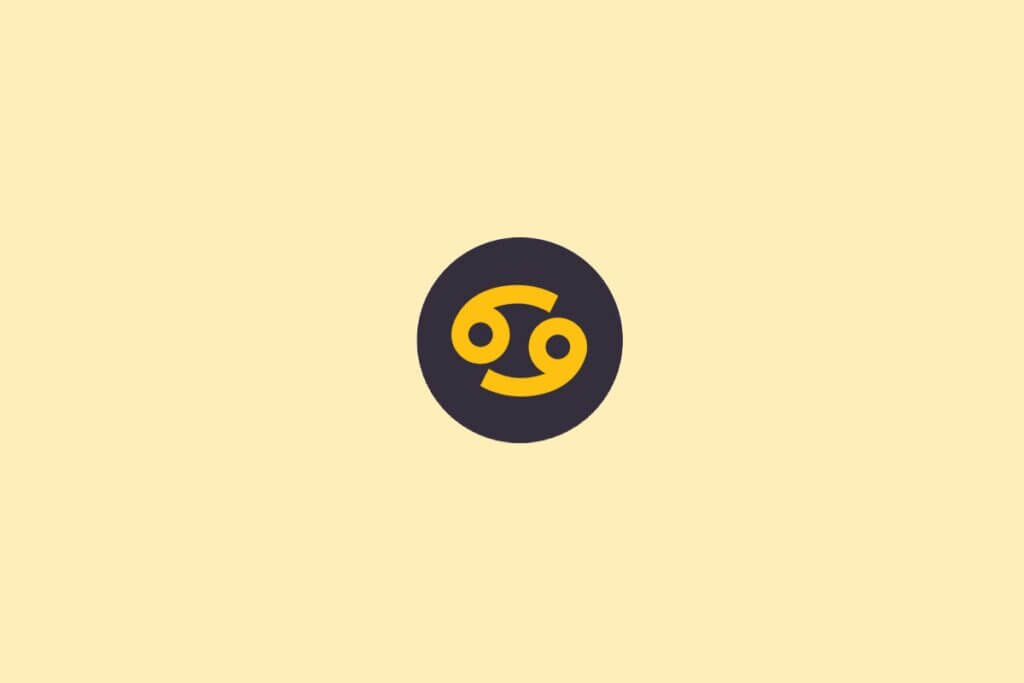 Um símbolo do signo de Câncer em amarelo, dentro de um círculo escuro, sobre um fundo claro bege