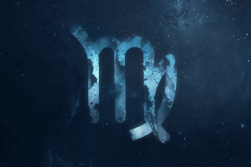 A imagem mostra o símbolo do signo de virgem em destaque sobre um fundo que representa o espaço, repleto de estrelas e nebulosas. O ícone aparece em tons de azul, com textura que se mistura ao cenário cósmico.