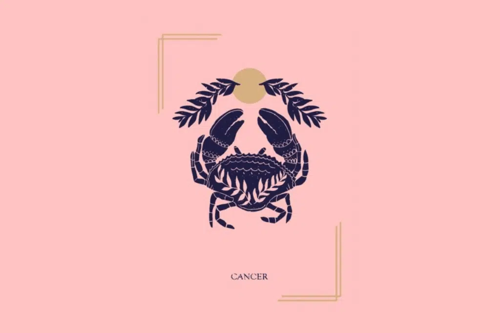 Ilustração mística sobre fundo rosa com a palavra "CANCER" na parte inferior. Ao centro, um caranguejo decorado com ramos de folhas abaixo de um círculo dourado e folhas.