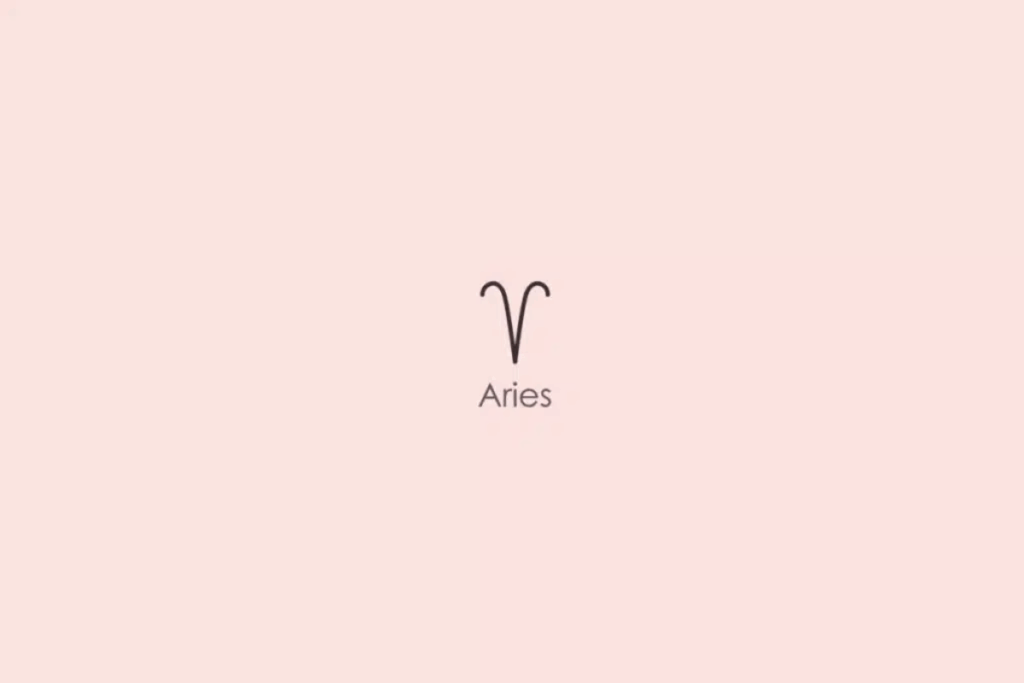 Ilustração minimalista do símbolo astrológico do signo de Áries, formado por duas linhas curvas que lembram os chifres de um carneiro, em tom escuro. Abaixo, aparece a palavra “Aries”, em inglês. O fundo é rosa