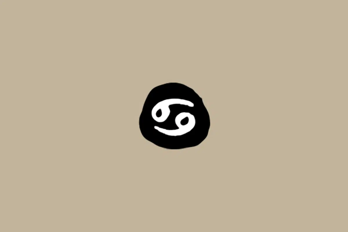 Símbolo do signo de Câncer em branco dentro de um círculo preto sobre um fundo bege 